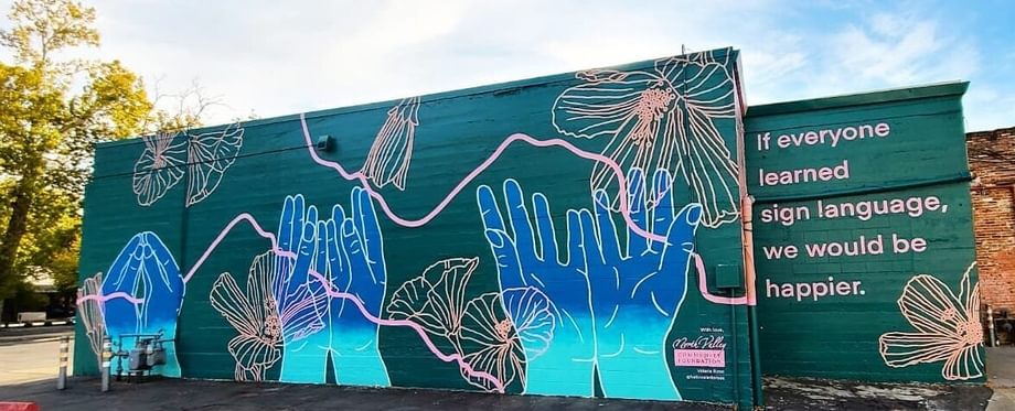 "Sign Language Mural," by Valerie Rose (@hellovalerierose) (W. 1st between Wall and Main)